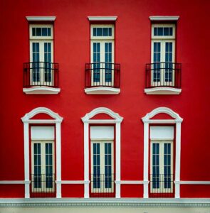 Red Facade in the City of San by Juan Joan LoBianco